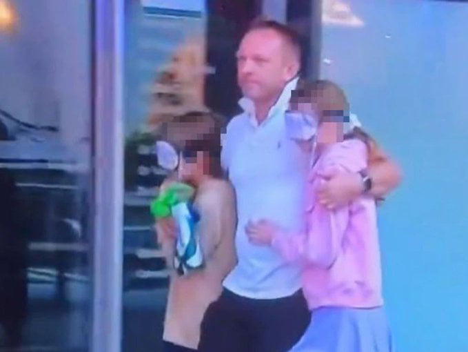 A father leaving the scene of the Bondi Junction Sydney mall