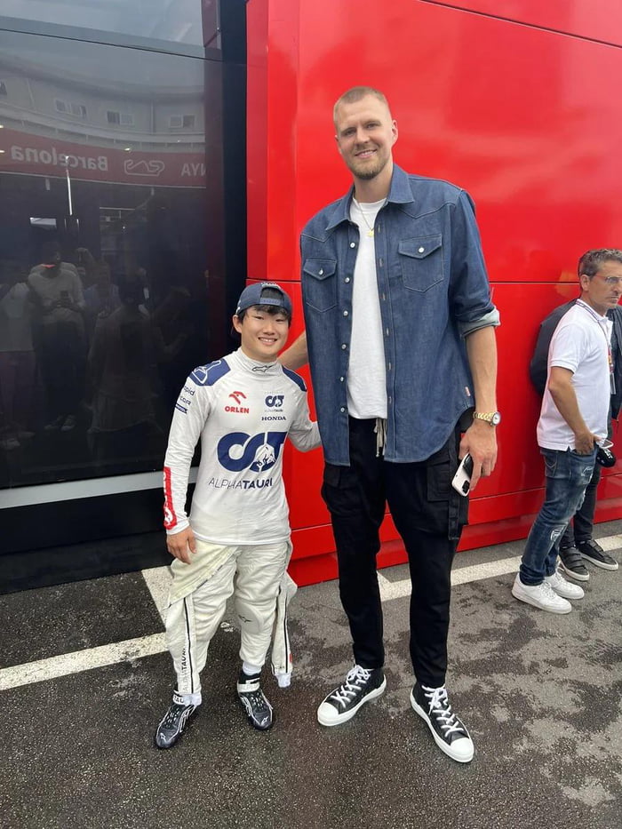 F1 driver Yuki Tsunoda next to NBA player Kristaps Porzingis