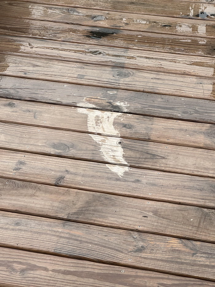 Spilled the grease trap from the grill on the deck, tried to Image