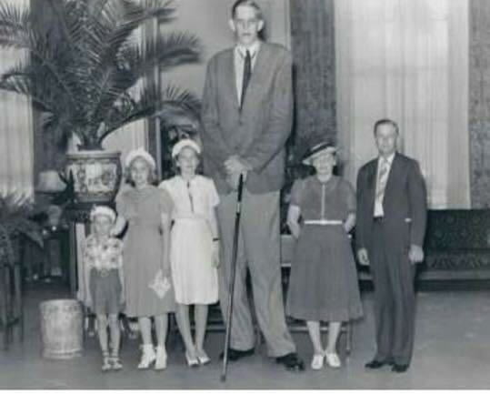 Robert Wadlow. Tallest man ever. He is standing 4th from the Image