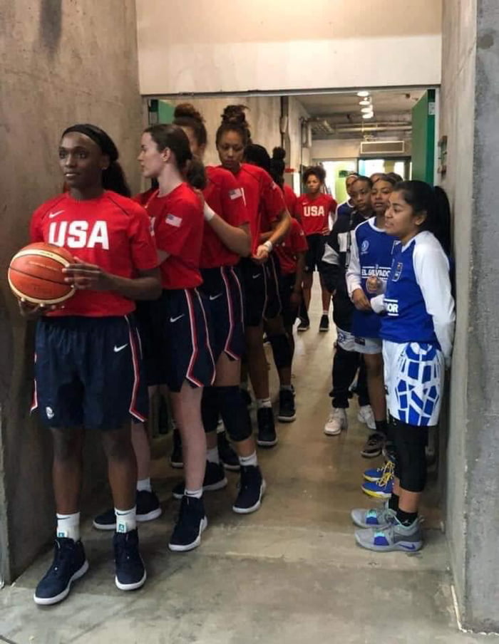 American U16 women's basketball team standing next to El Sal