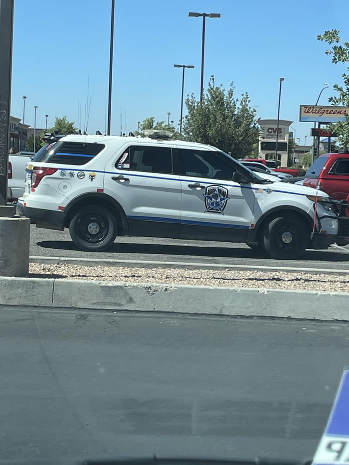 “Police lives matter” with trump stickers on back and si